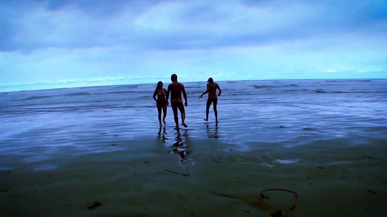 Big ass on the beach with several naked women having sex