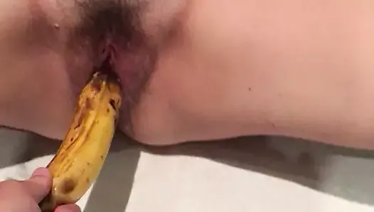 Asian wife playing with banana