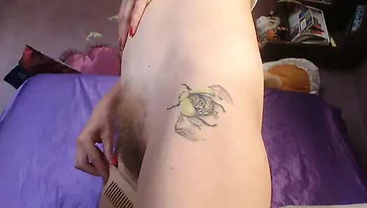 Brushing pussy hairs. Side view