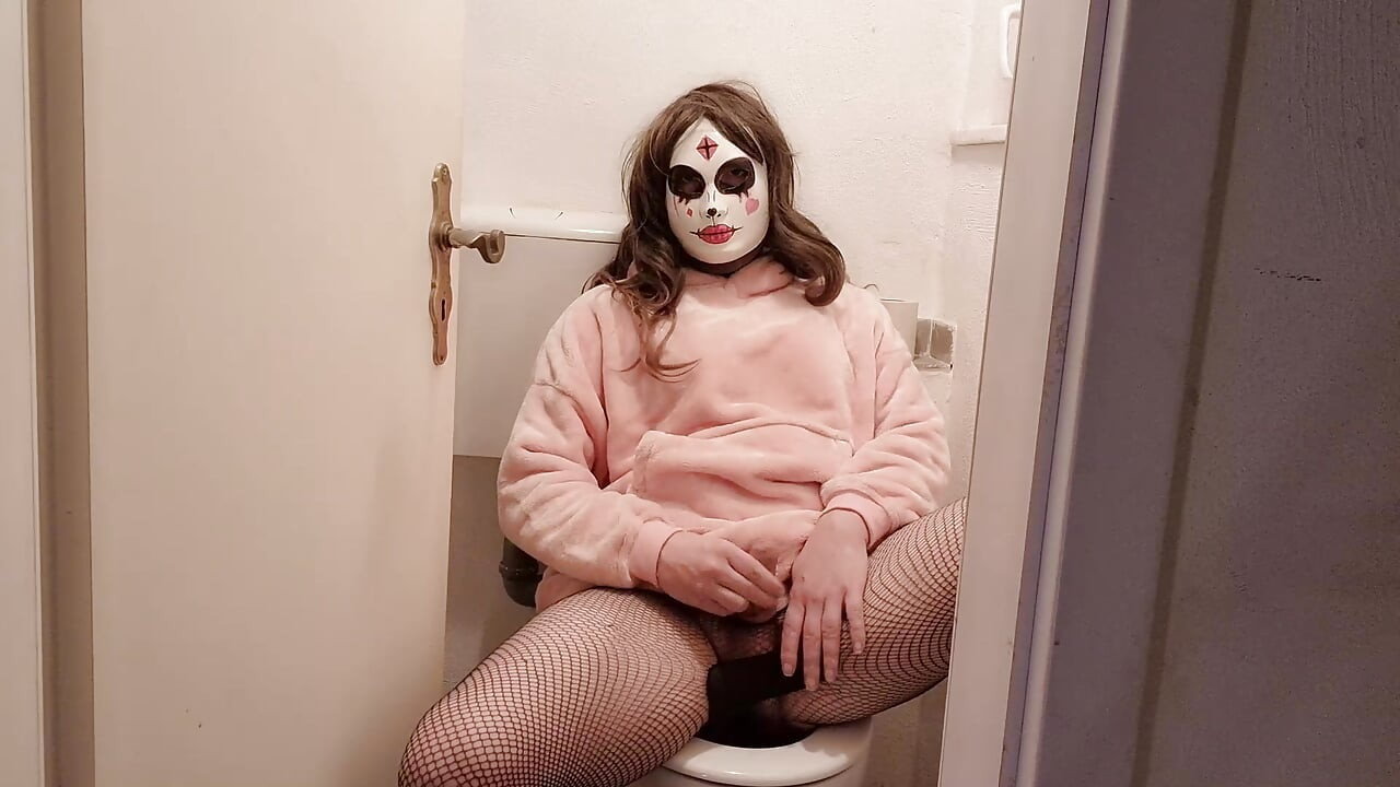 Young trans woman jerks off in the toilet