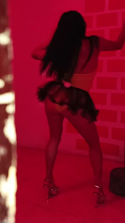 The nightclub has a very sensual Colombian visiting her! She dances beautifully with a customer. | Clip 1
