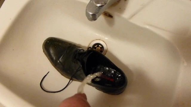 Piss in men's dress shoe