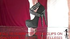 Mistress Elle in her diamond heels reminds her useless slave where he belongs