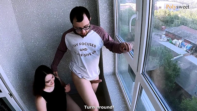 The guy looks at the neighbors while the girl licks his ass