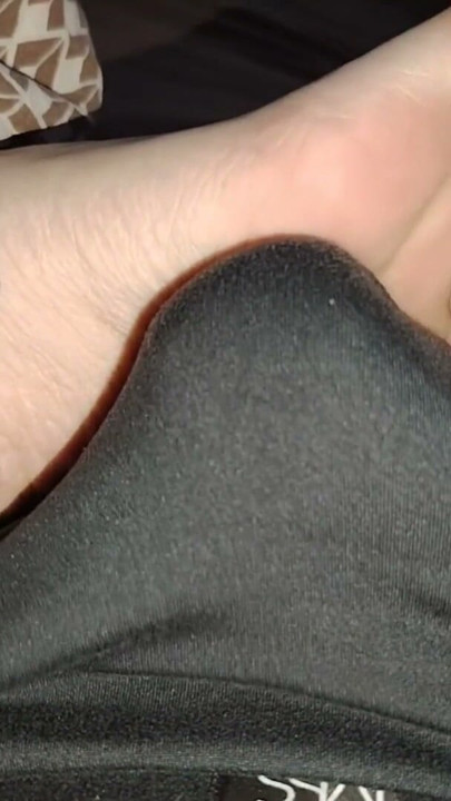 Stepsister's feet get a light massage while watching a movie | Clip 1