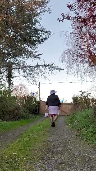 Dressed in a lilac dress and a hat for an evening