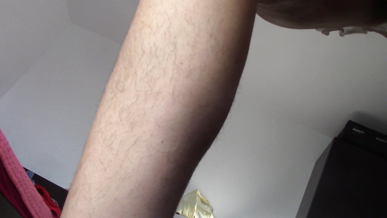 Amateur wife dancing naked at home. Amateur woman has fun trying on clothes and cutting them.