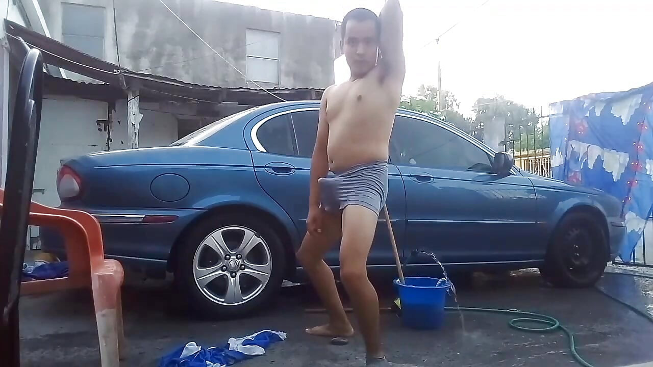 Jesus in gray boxer washing his jaguar car