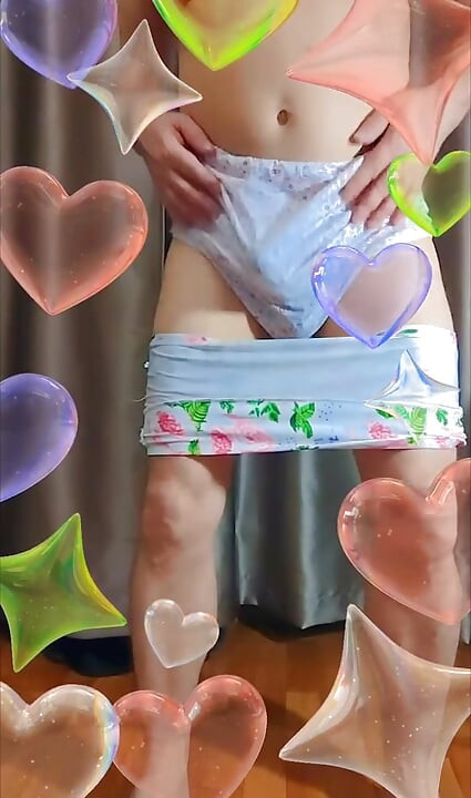 a crossdresser tries on large floral cotton pants