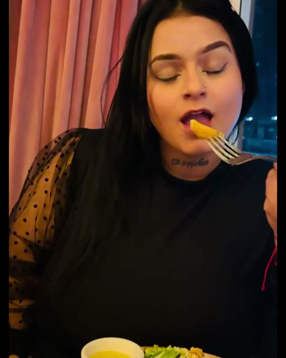 Latina and hot eating in an extremely delightful way