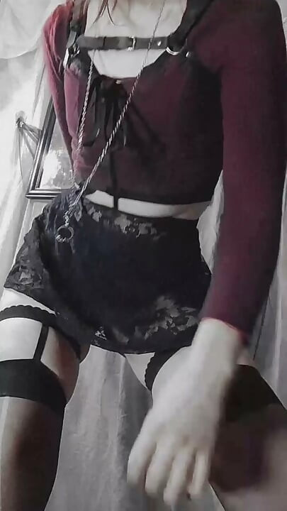 Sexy gothic Latina doing a striptease dance showing off her hairy vagina