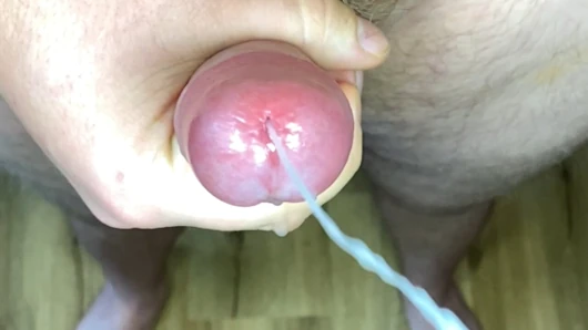 Close up cock edging cum