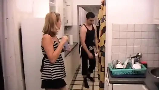 Poor Dude Must Clean Kitchen on Order of His Mistress