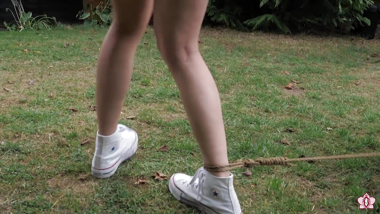 Half-stripped, Bell-jingling Slave Mila Drooling Through Tongue Clamp Is Made to Walk Outdoor Fountain Laps with Crotch Rope Saw