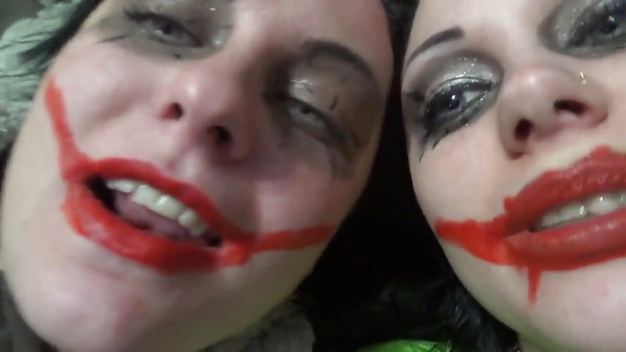 Two crazy clown girls dangle you above their hungry mouths before fighting over who will eat you alive