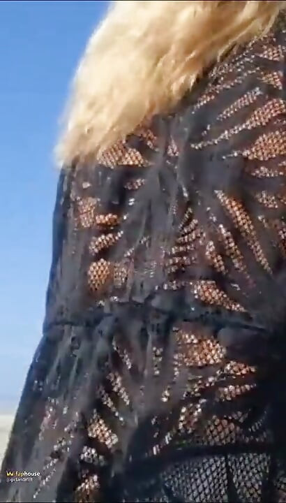 Hot Crown Sunbathing on the Beach in Transparent Micro Bikini
