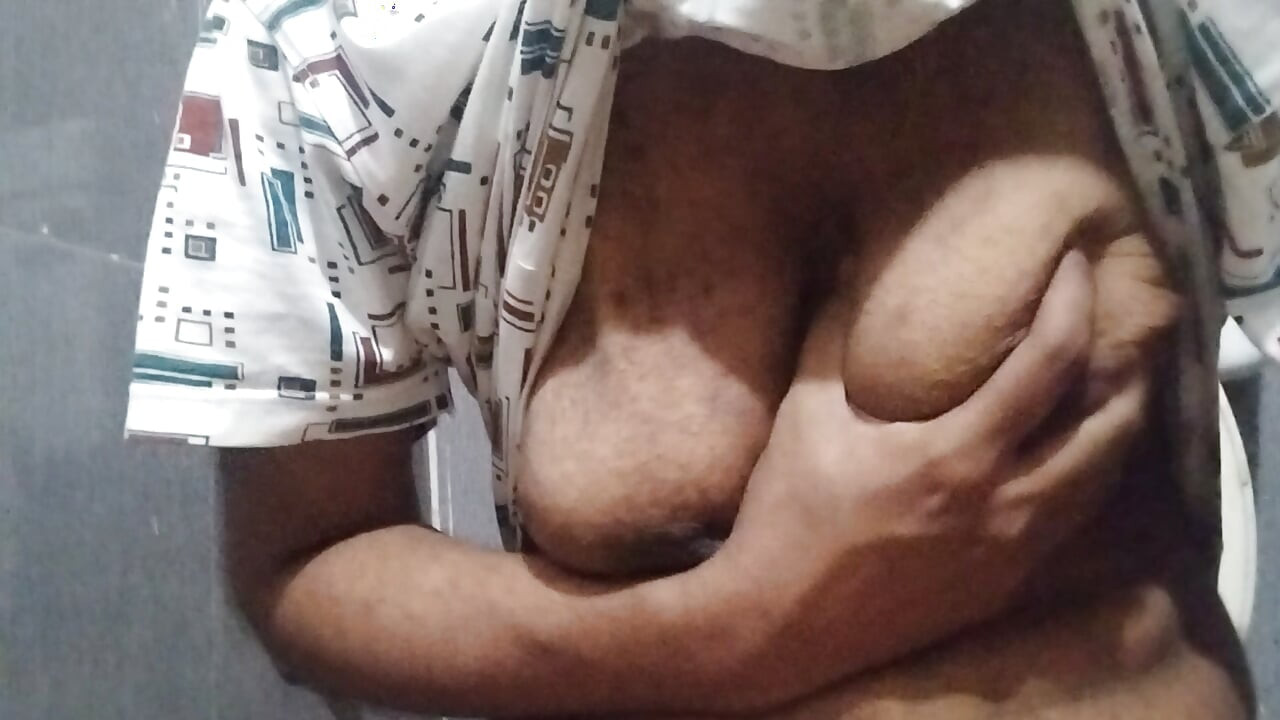 Busty Indian babe playing with her boobs and pussy while peeing