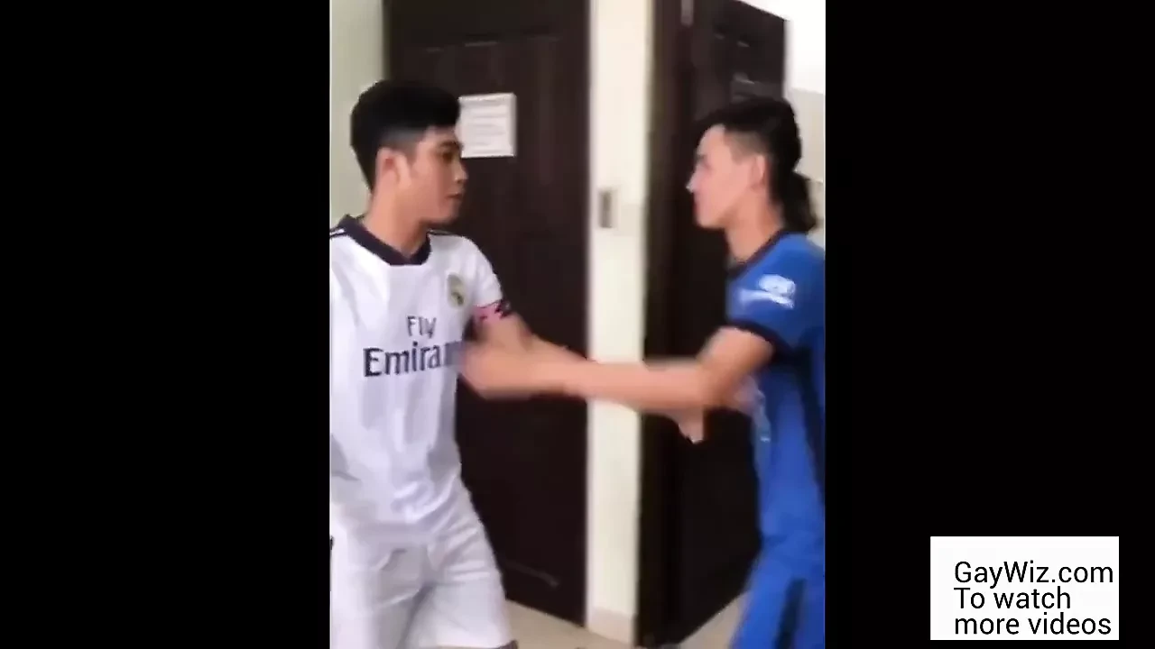Two Asians wearing soccer uniform have sex