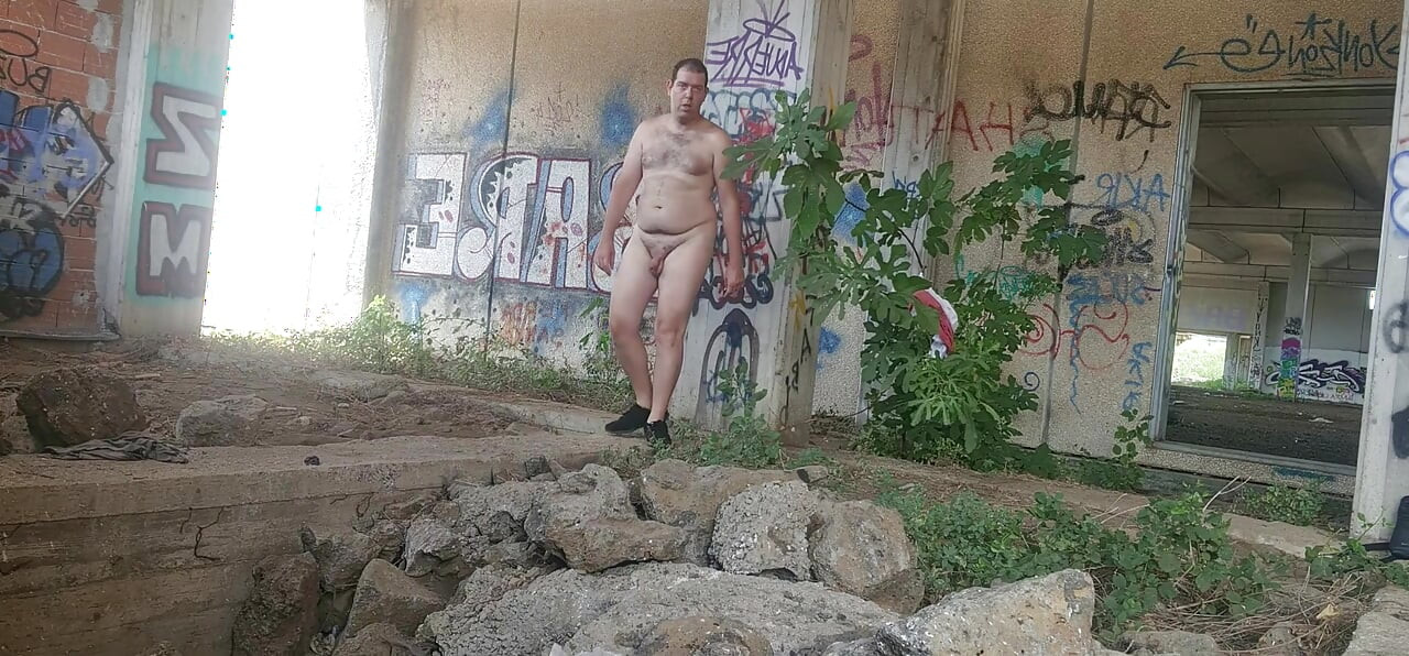 Naked boy in an abandoned building
