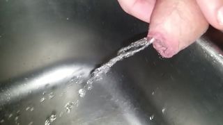 Slow Motion Pissing in Sink