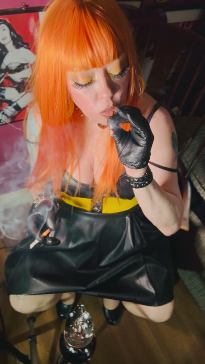 Redhead Tina Snua Smoking 2 Cigarettes At A Time Wearing A Leather Dress & Gloves | Clip 1