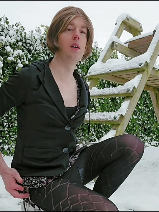 Dressed up and riding dildo in the snow