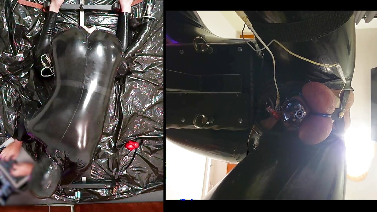 Session in the pillory with Latex Catsuit, PA Chastity, Giant Didildo and Estim