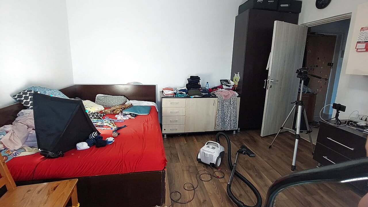 An amateur woman cleans the house with the vacuum cleaner. Sexy mom has fun with naked roses