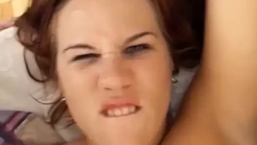 A redhead tattooed girl in a lustful threesome