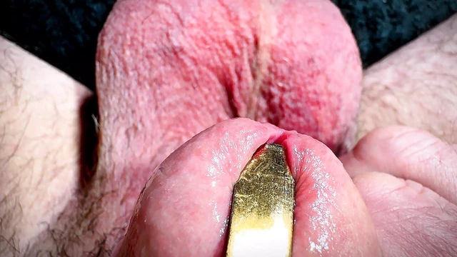 Golden spoon in the penis
