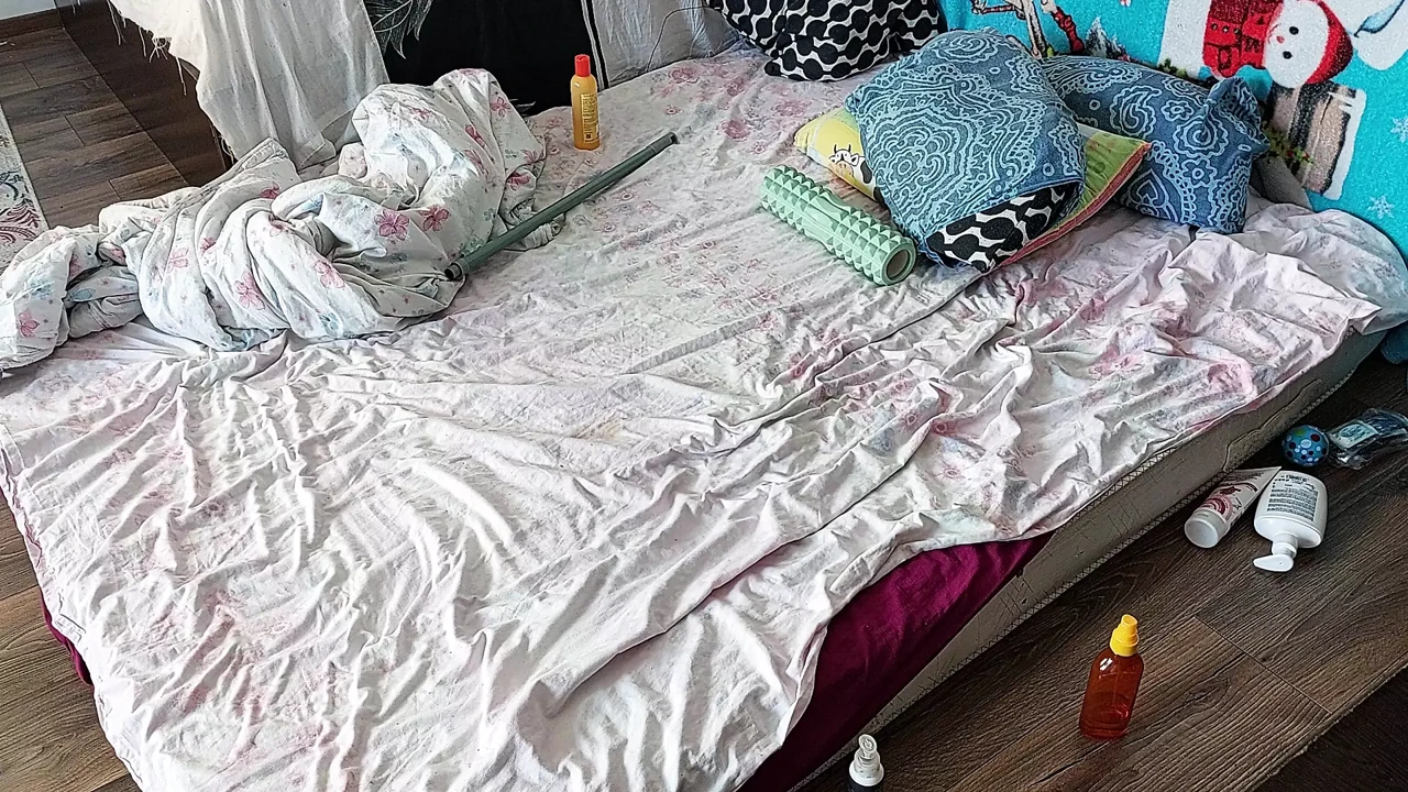 Sensual massage of a sexy couple with oil on the body. Foreplay in the bedroom with an amateur couple.