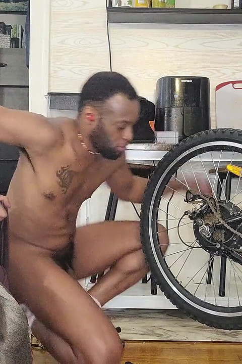 Kennie Jai Does a Nude Bike Repair. Watch That Big Dick Swing!