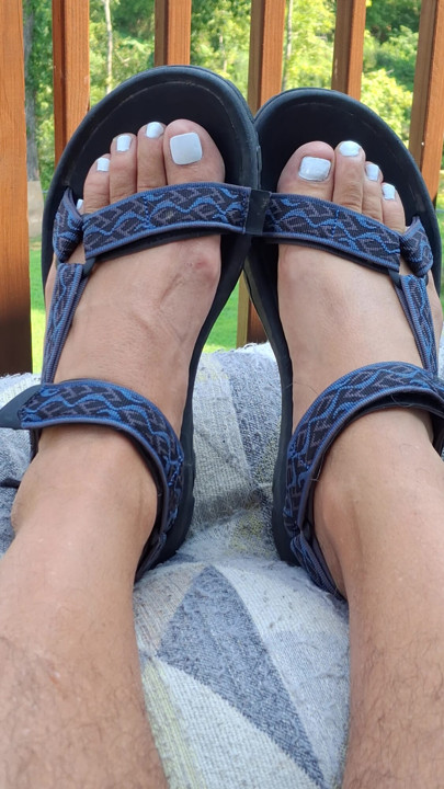 Showing off my painted white toes in strappy Teva sandals