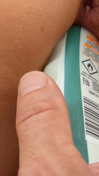 Captivating moment from "Insertion of toys hand and suncream bottle in my french milf wife's pussy whilst sunbathing outside"