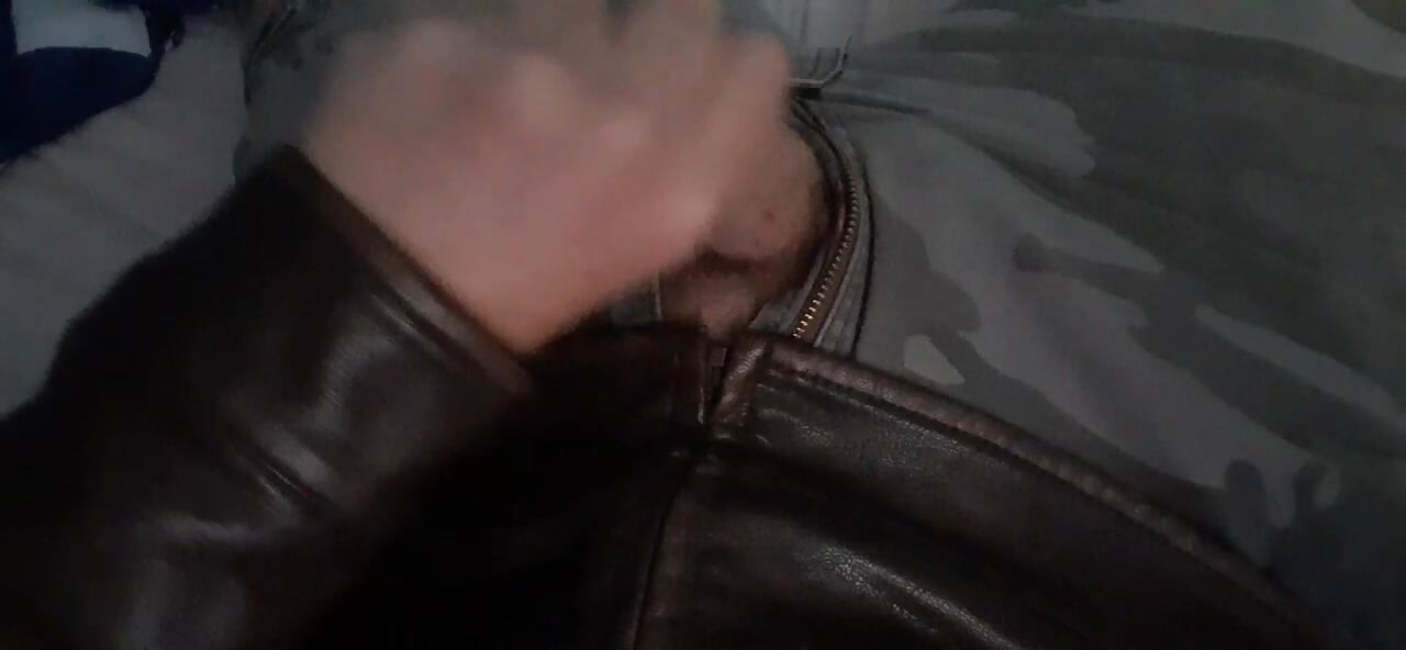 Biker blows his load on his leather jacket