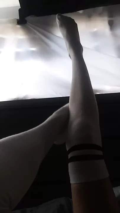 Sexy hot woman with legs for days, wearing white knee highs