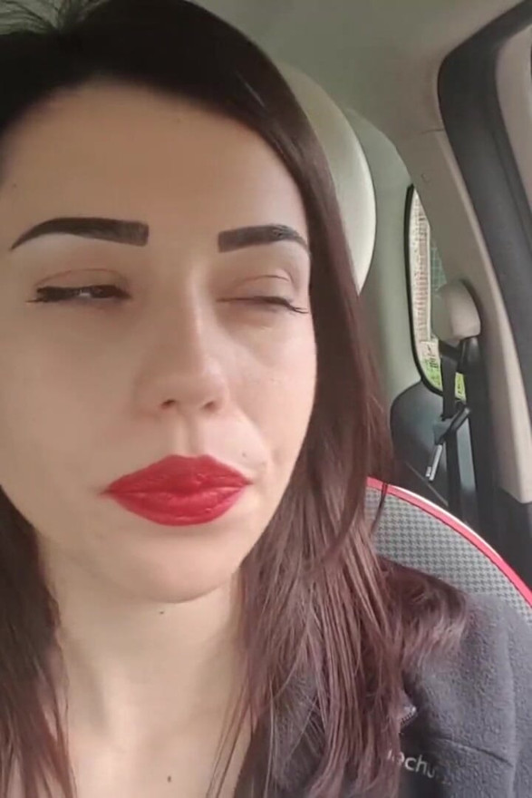 Good looking Petra smoking in her car