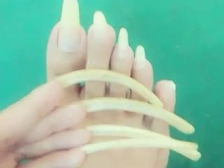 Kheora Seong clear long fingernails and toenails