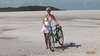 Passionate fucking on the beach with a stunning blonde with big tits