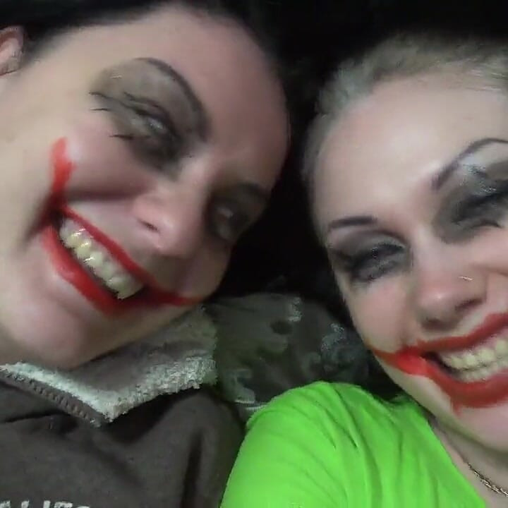 Two crazy clown girls dangle you above their hungry mouths before fighting over who will eat you alive