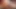 Brown ladyboy with short hair strips her white dress and