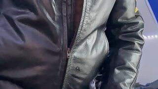 Bearded guy in leather jacket fucks his leather glove