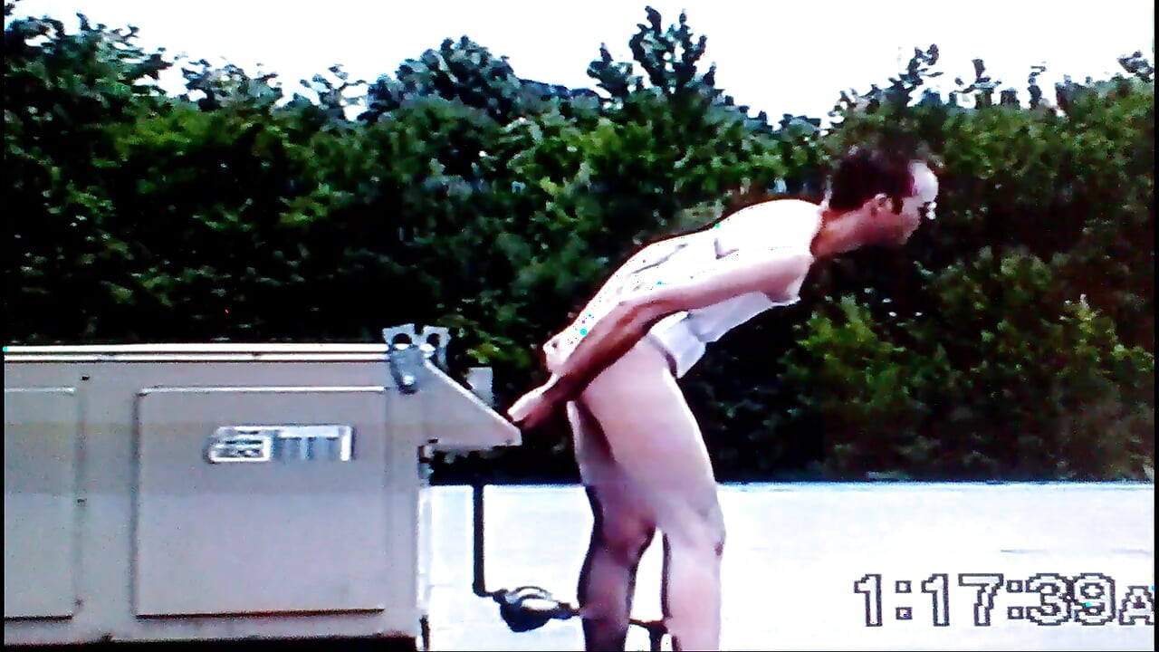 Crossdresser Riding a Giant Dildo on a Roof Top
