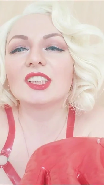 Emotional moment from "Strap-on POV video: topless Mistress in thigh high over knee boots with long gloves - Arya Grander"