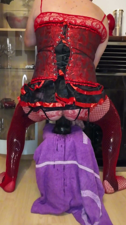 Crossdresser in corsage with mini skirt and latex stockings + fishnet stretches the anal pussy to the maximum with huge plugs | Clip 1