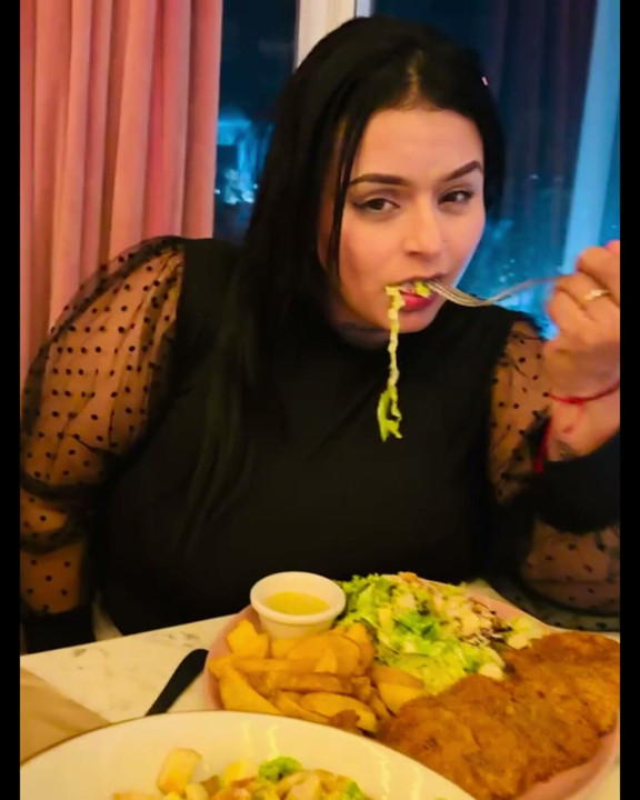 Latina and hot eating in an extremely delightful way