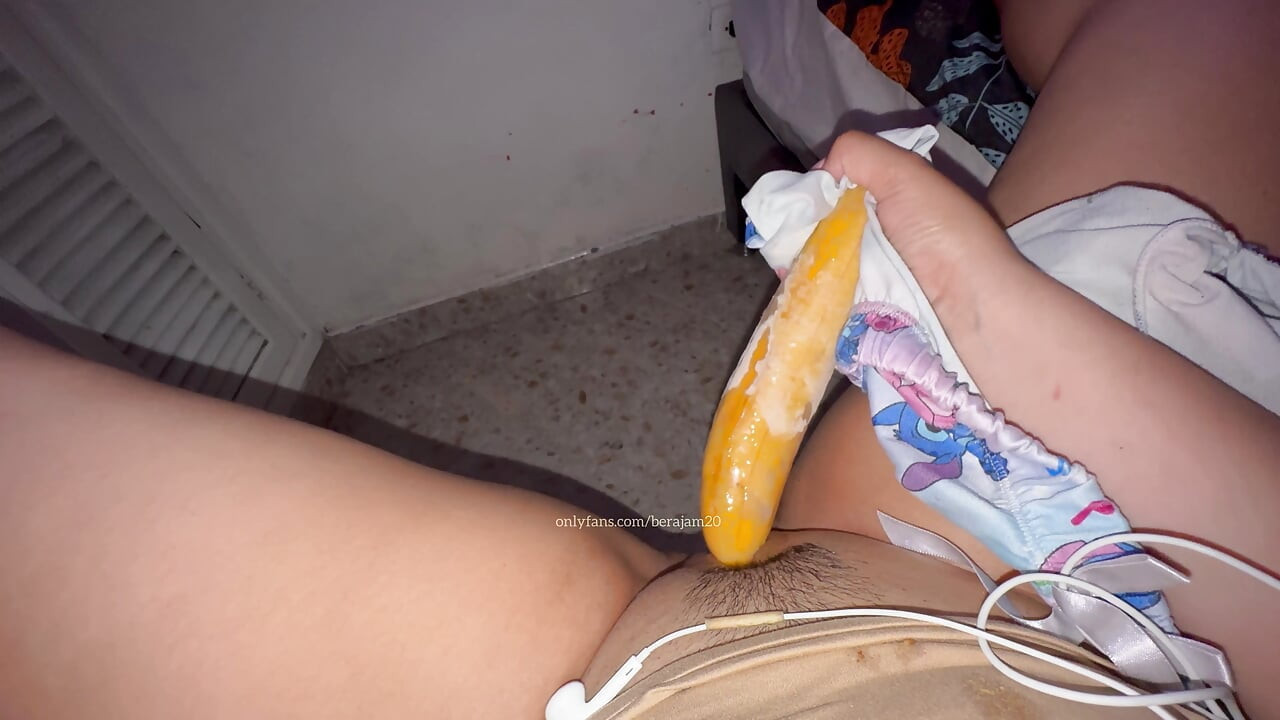 Trying for the first time young girl with cucumber