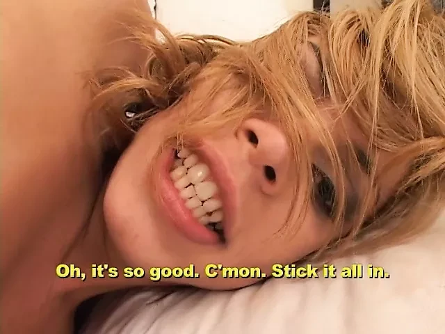 Blond shemale sucks his best friend&#039;s cock in the living room on a white couch
