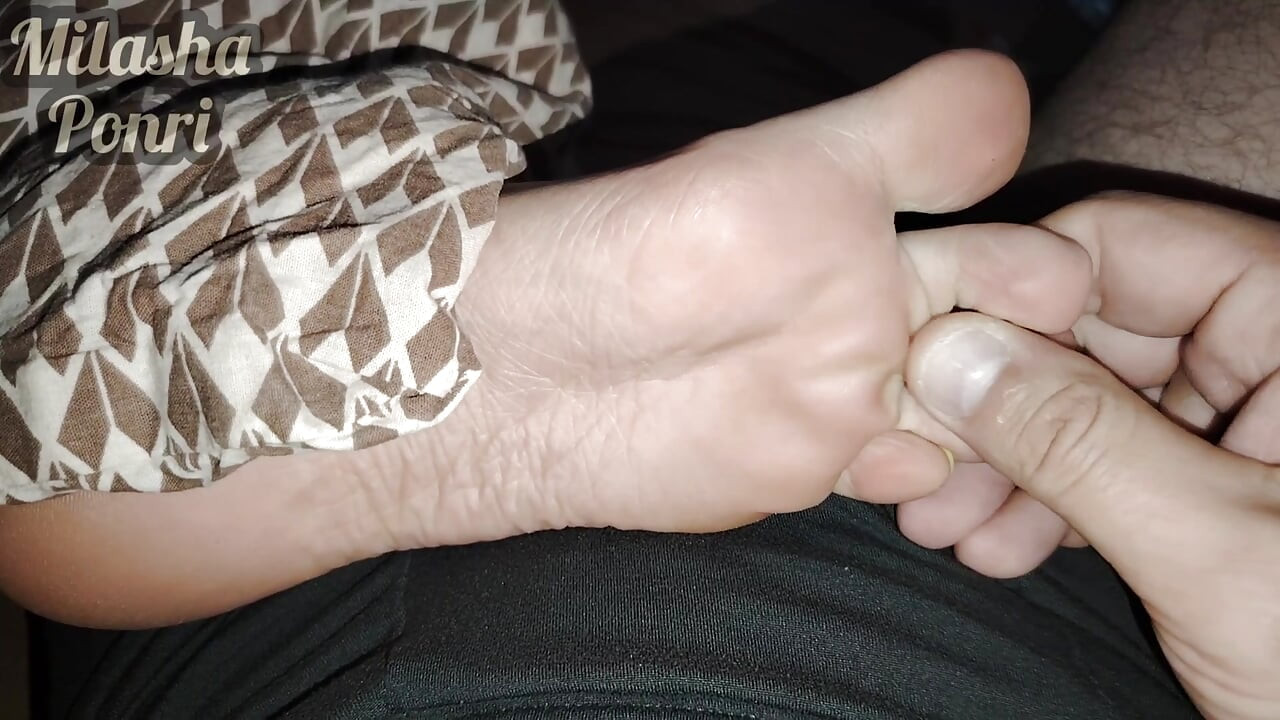 Stepsister's feet get a light massage while watching a movie