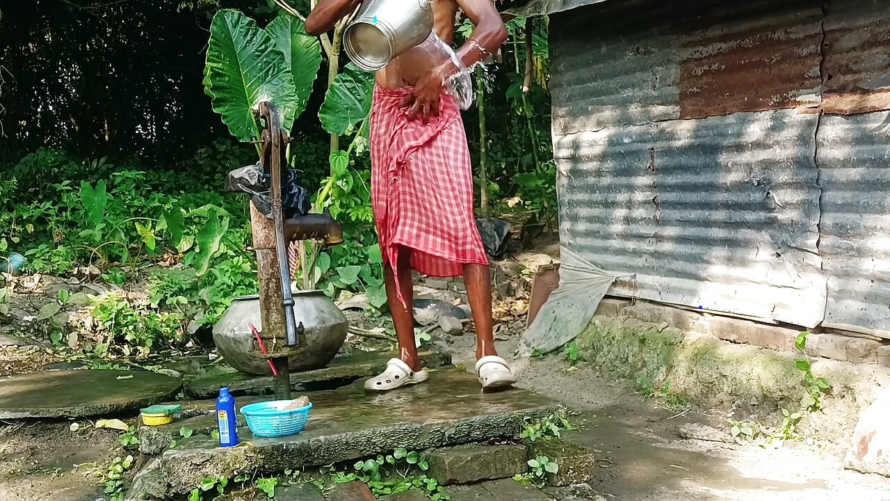 Desi young man bath Open place.